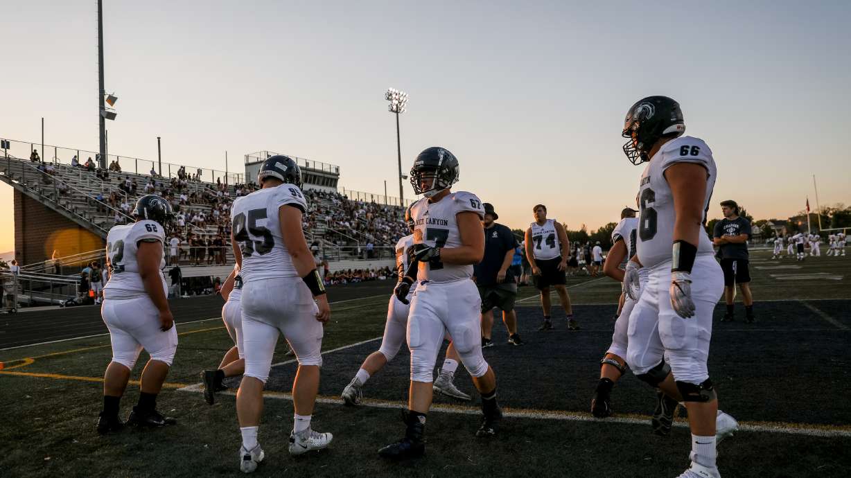 Players warm up with drills as Corner Canyon football hosts its annual intrasquad scrimmage in Draper on Friday, Aug. 7, 2020.