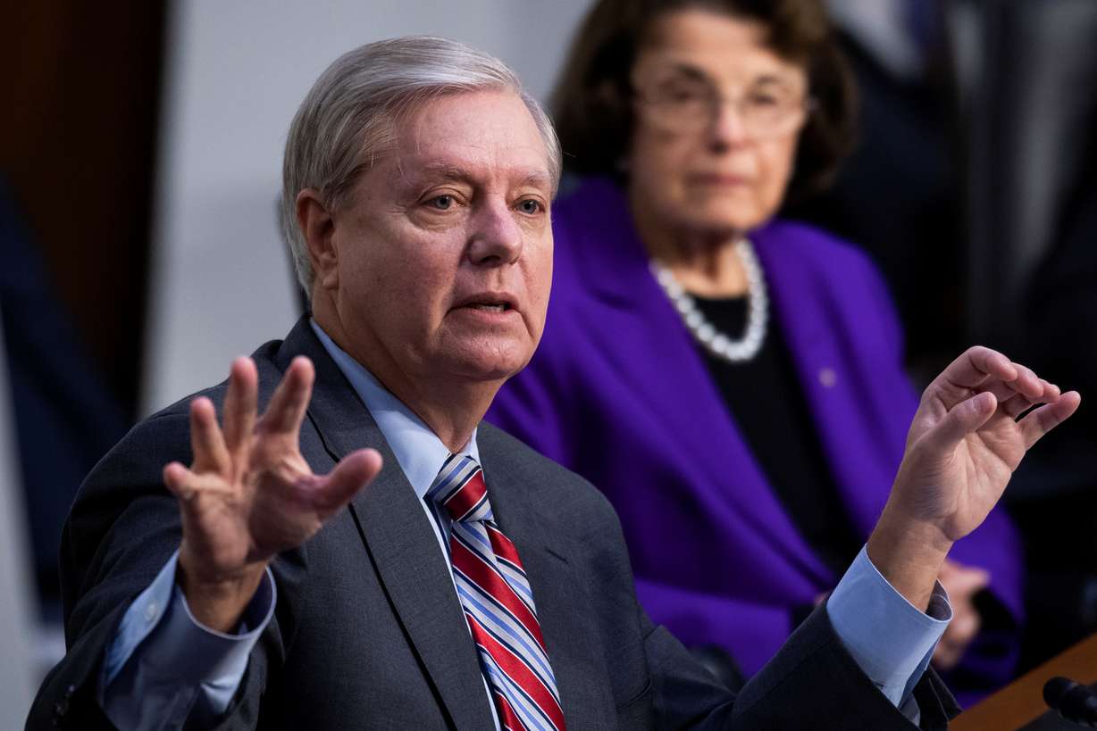 Senate Judiciary Committee Chairman Sen. Lindsey Graham (R-SC) speaks as, U.S. Senate Judiciary Committee Ranking Member, Dianne Feinstein listens during the fourth day of the confirmation hearing for Supreme Court nominee Judge Amy Coney Barrett before the Senate Judiciary Committee on Capitol Hill in Washington, DC, U.S., October 15, 2020. Tom Williams/Pool via REUTERS