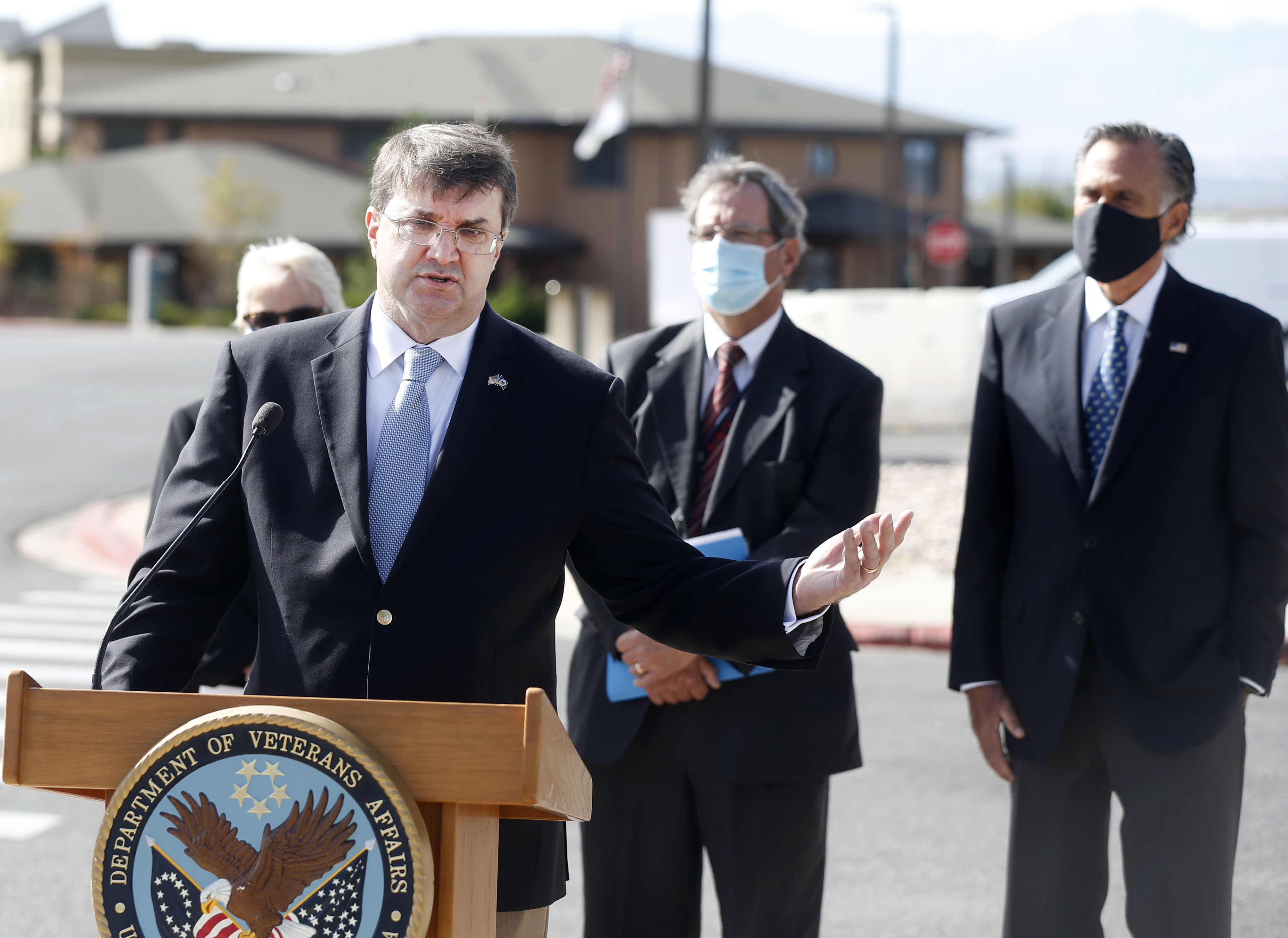 Department of Veterans Affairs Secretary Robert Wilkie speaks to reporters at the VA Medical Center in Salt Lake City on Thursday, Oct. 15, 2020. Standing with Wilkie is Shella Stovall, director of the VA Medical Center, left, VA Rocky Mountain Network Director Ralph T. Gigliotti, and U.S. Sen. Mitt Romney, R-Utah.