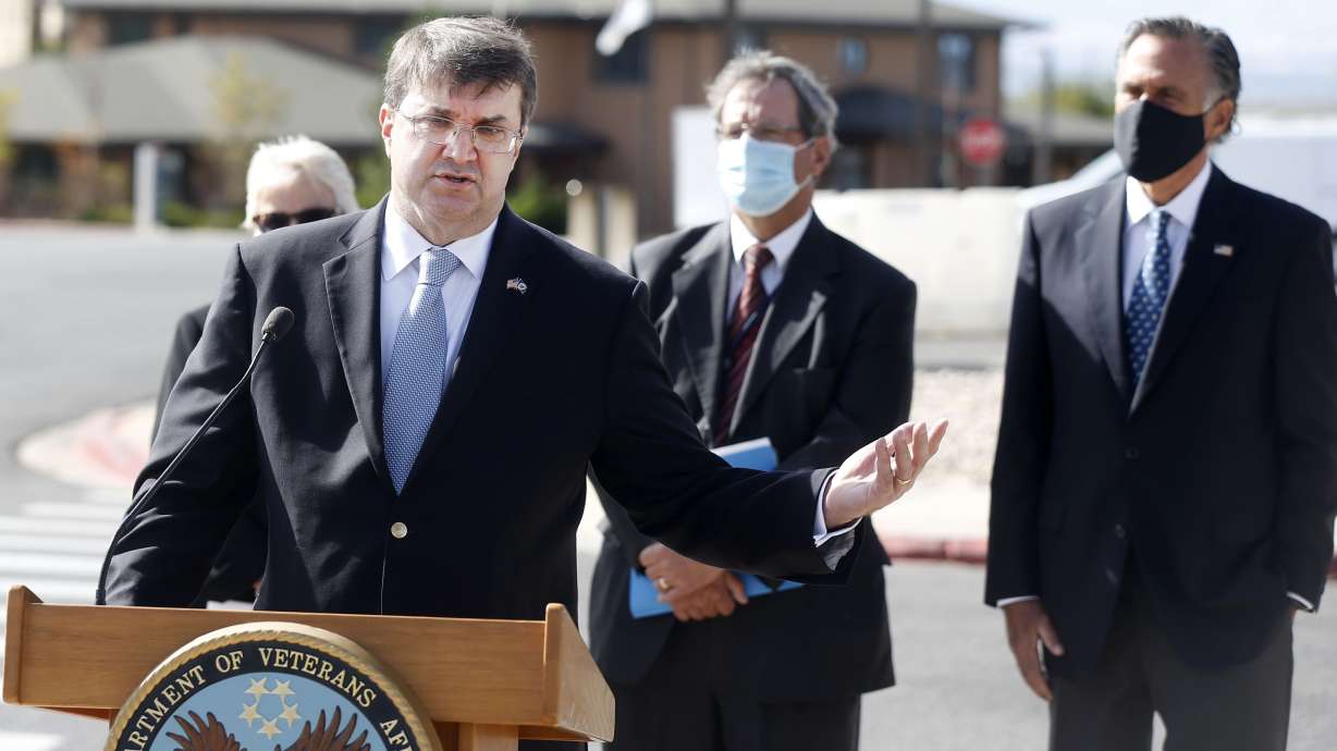 Department of Veterans Affairs Secretary Robert Wilkie speaks to reporters at the VA Medical Center in Salt Lake City on Thursday, Oct. 15, 2020. Standing with Wilkie is Shella Stovall, director of the VA Medical Center, left, VA Rocky Mountain Network Director Ralph T. Gigliotti, and U.S. Sen. Mitt Romney, R-Utah.