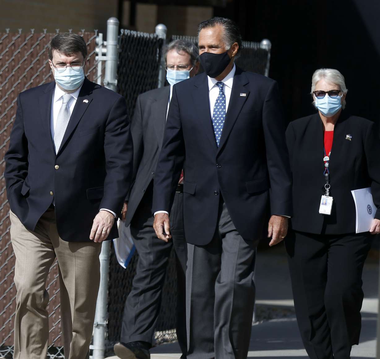 Department of Veterans Affairs Secretary Robert Wilkie, left, VA Rocky Mountain Network Director Ralph T. Gigliotti, U.S. Sen. Mitt Romney and Shella Stovall, director of the VA Medical Center, walk to a podium to speak to the media at the VA Medical Center in Salt Lake City on Thursday, Oct. 15, 2020.