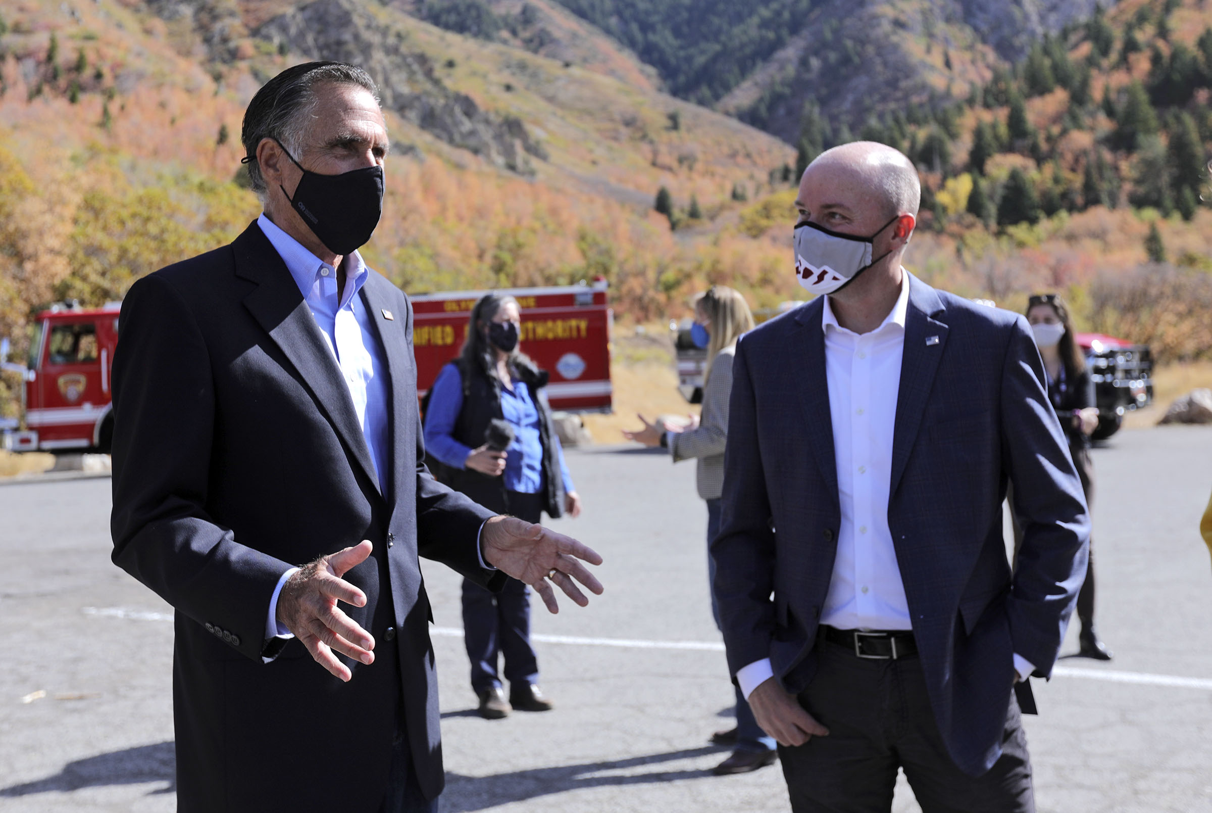 Sen. Mitt Romney, R-Utah, talks with Lt. Gov. Spencer Cox after a press conference announcing Romney's plan to establish a wildfire commission, to review national wildfire policies and make recommendations to Congress, at the Neff's Canyon trailhead in Millcreek on Thursday, Oct. 15, 2020. A recent wildfire in Neff's Canyon is 100% contained but still smoldering.