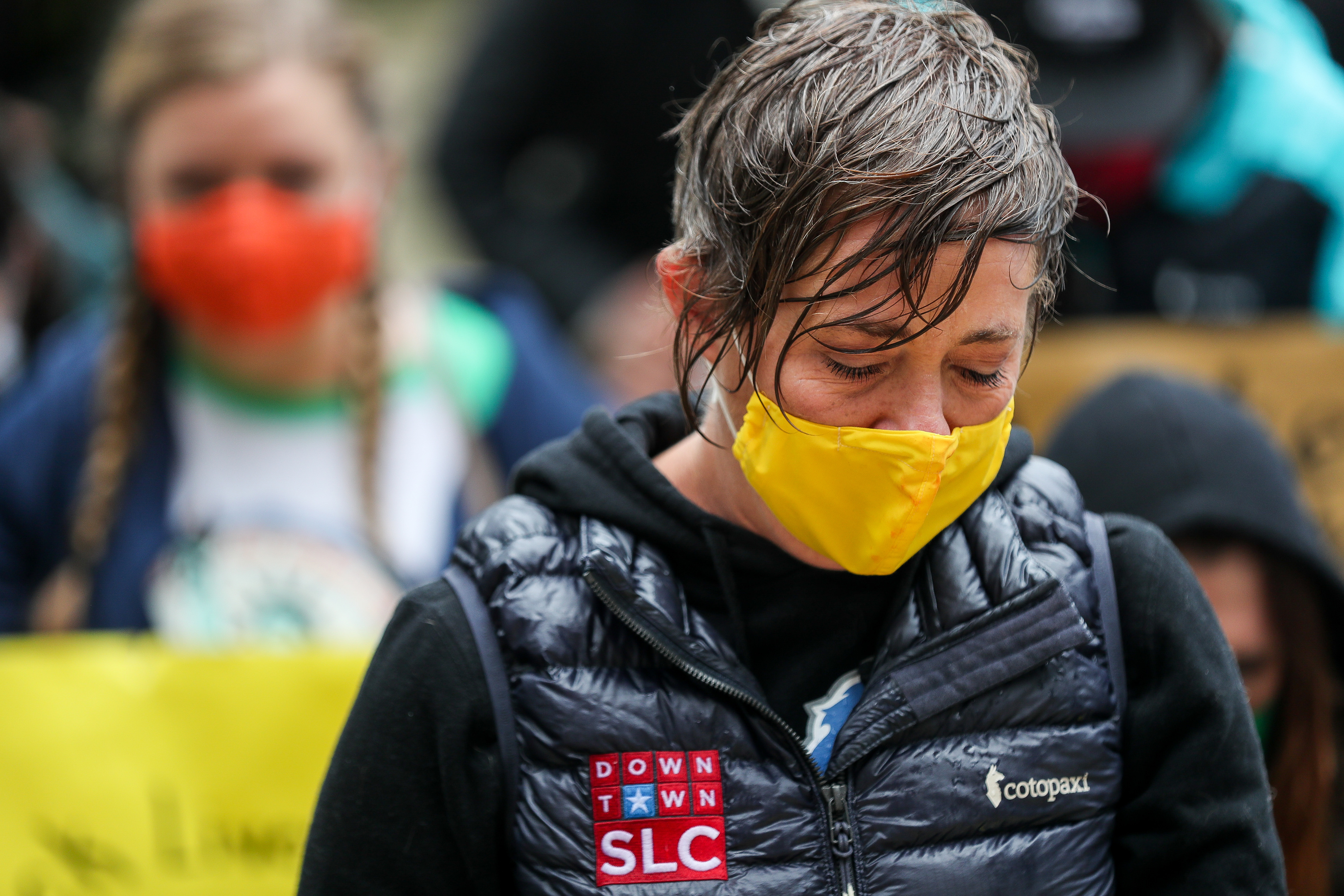 Amy Fowler, a member of the Salt Lake City Council, kneels with others for 8 minutes and 46 seconds after marching through the rain to the City-County Building in Salt Lake City on Monday, June 8, 2020. Attorneys from the Salt Lake Legal Defender Association and other supporters marched to honor George Floyd, Breonna Taylor and Ahmaud Arbery and to show support for addressing and ending racism.