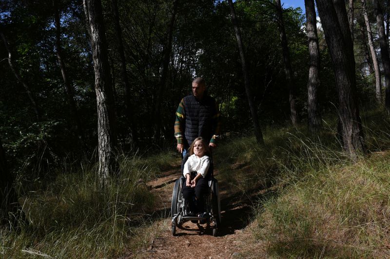 FILE PHOTO: Eleftheria Tosiou and Marios Giannakou are seen in a park during an interview with Reuters in Drama, Greece, October 14, 2020. REUTERS/Alexandros Avramidis
