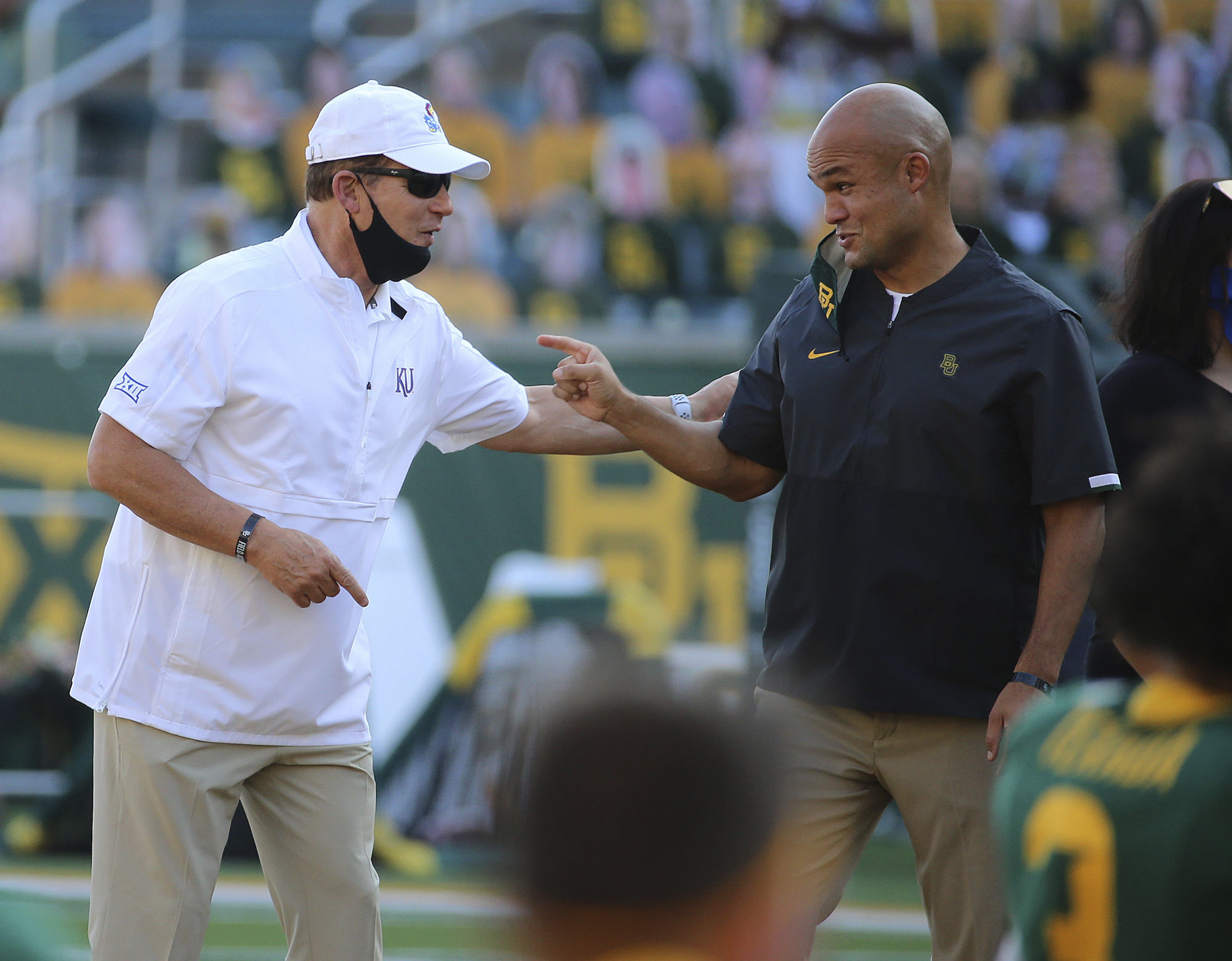 Kansas head coach Les Miles, left and Baylor head coach Dave Aranda, right, greet each other before start of an NCAA college football game in Waco, Texas, Saturday, Sept. 26, 2020. (Photo: Jerry Larson/Waco Tribune-Herald via AP)