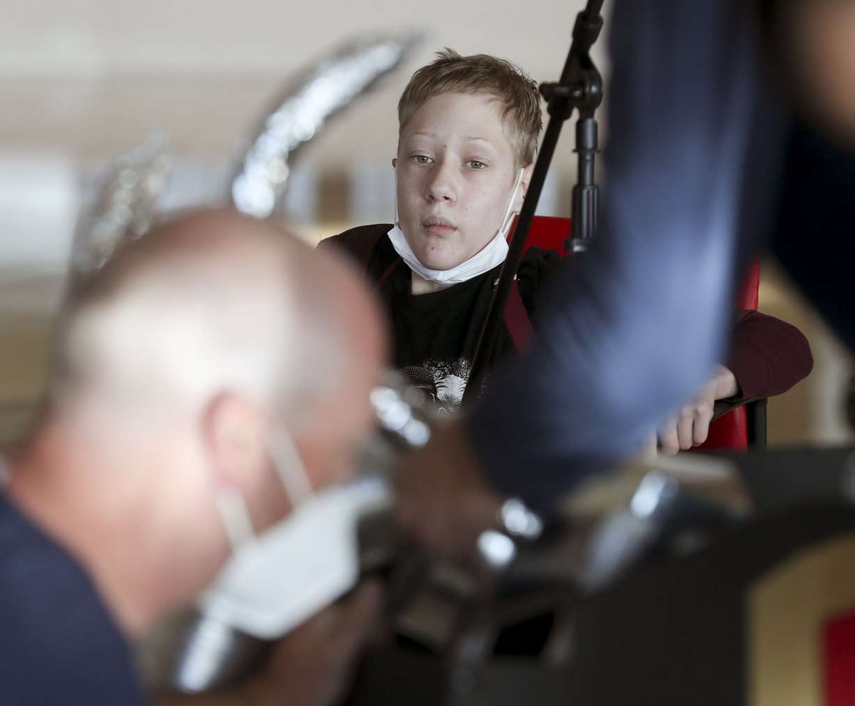 Skylar Skuza watches as hospital staff and volunteers decorate his wheelchair in a Power Ranger theme during the hospital’s annual wheelchair costume clinic at Shriners Hospitals for Children in Salt Lake City on Thursday, Oct. 15, 2020.