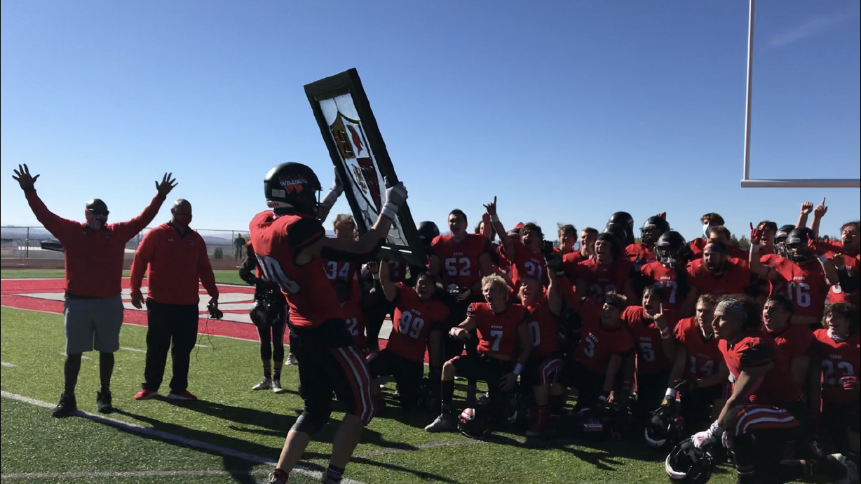 Spencer Hall collects the Shield after Weber's 35-8 win over Roy in a Region 1 football game, Friday, Oct. 16, 2020 in Pleasant View.