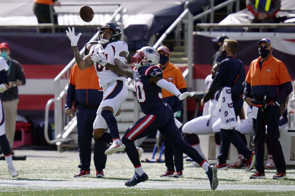 Denver Broncos wide receiver Tim Patrick (81) catches a pass as New England Patriots cornerback Jason McCourty (30) defends in the first half of an NFL football game, Sunday, Oct. 18, 2020, in Foxborough, Mass.