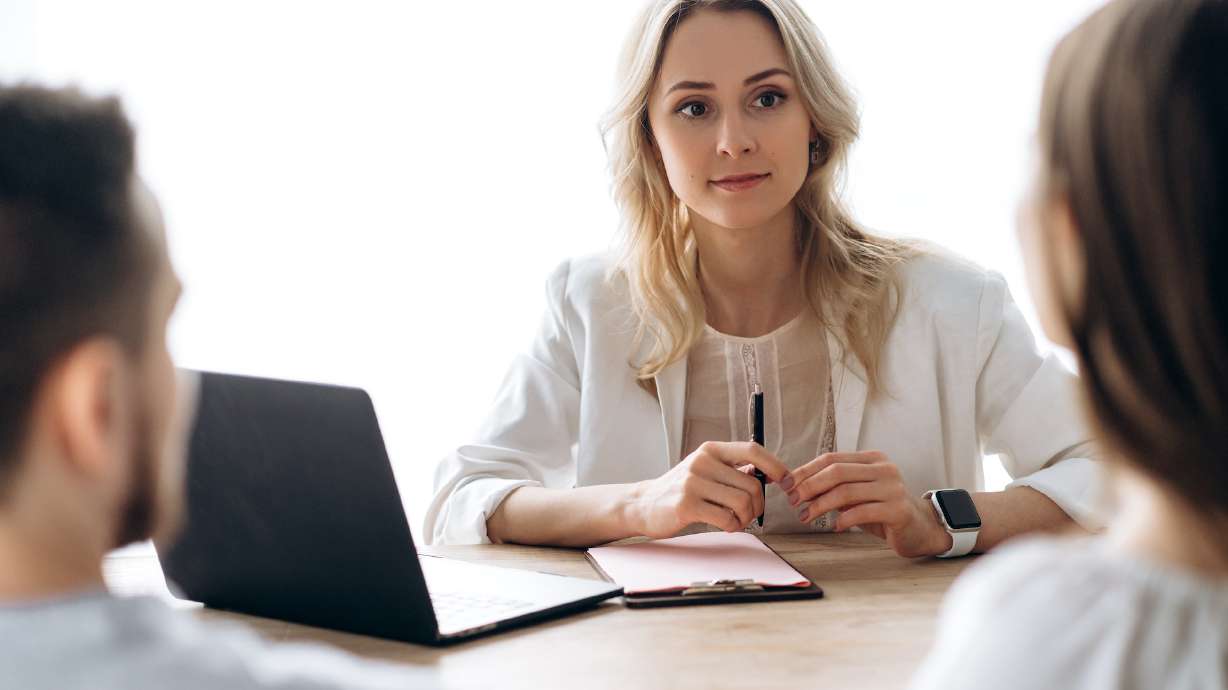 Brainstorm with business colleagues. Girl supervisor holds a meeting with her business team in the office