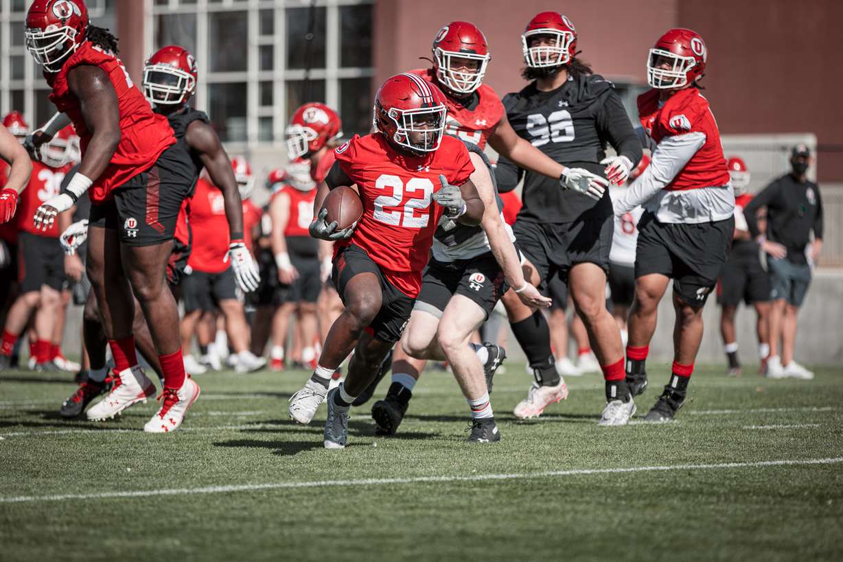 Freshman running back Ty Jordan breaks free on a run during fall camp at the University of Utah.