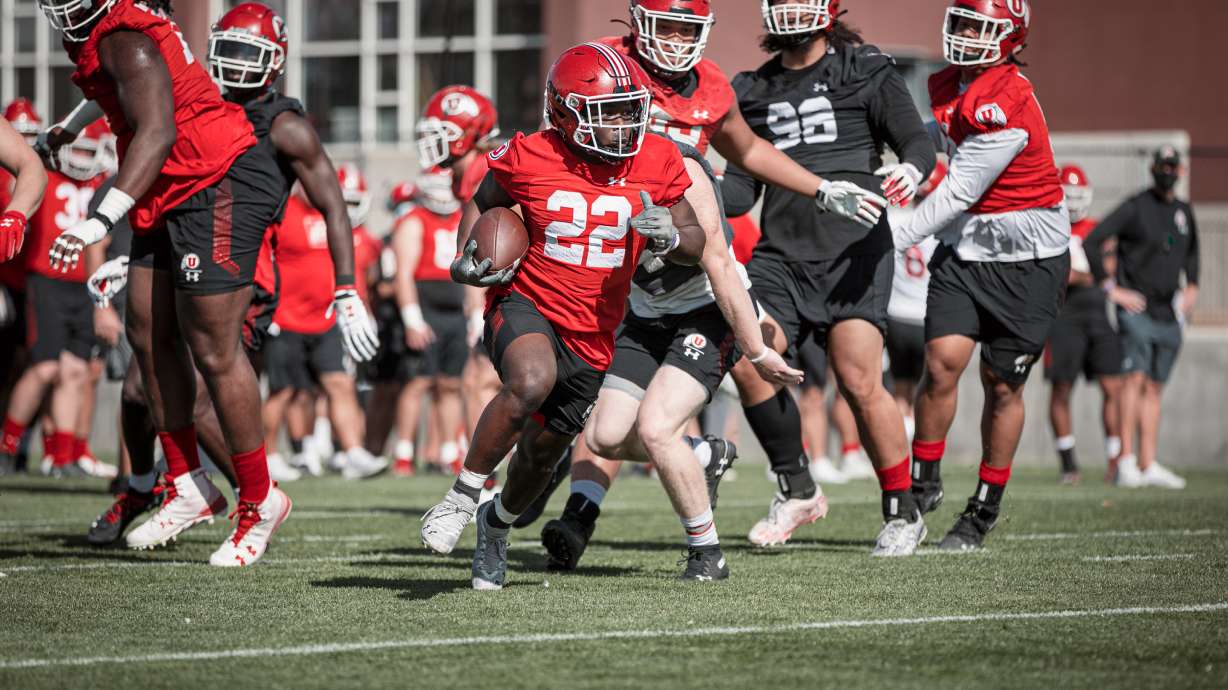 Freshman running back Ty Jordan breaks free on a run during fall camp at the University of Utah.