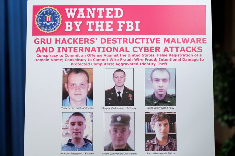 A poster showing six wanted Russian military intelligent officers is displayed before a news conference at the Department of Justice, in Washington, U.S., October 19, 2020. Andrew Harnik/Pool via REUTERS