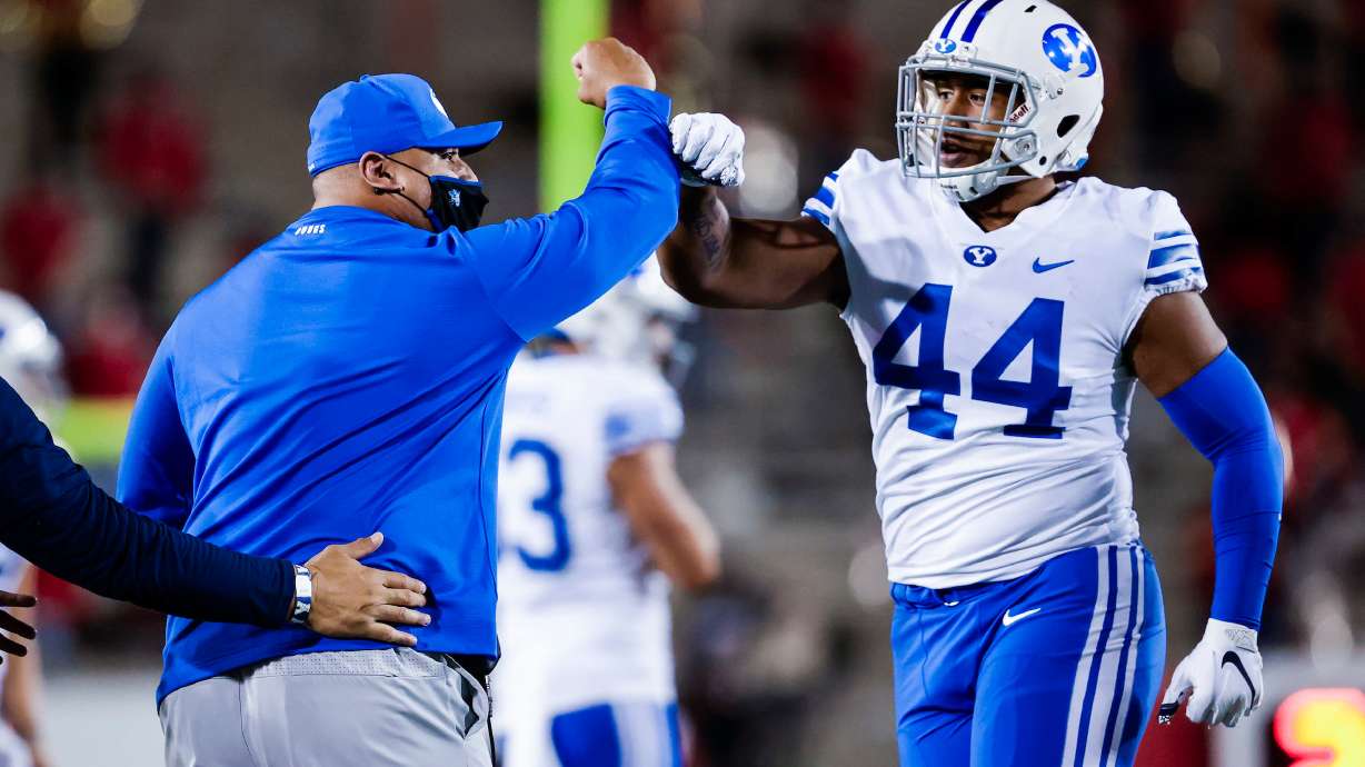 (#44) Seleti Fevaleaki celebrates with Coach Kalani Sitake at the end of the fourth quarter. BYU played Houston at TDECU Stadium in Houston, Texas on October 16, 2020.
