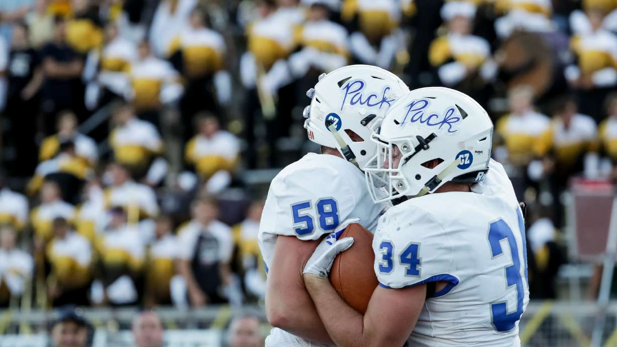 Fremont's Hunter Judkins and Chaedon Dayton celebrate after Dayton scored, putting Fremont up 7-0 over Davis after the PAT, during a high school football game at Davis High School in Kaysville on Friday, Sept. 14, 2018.