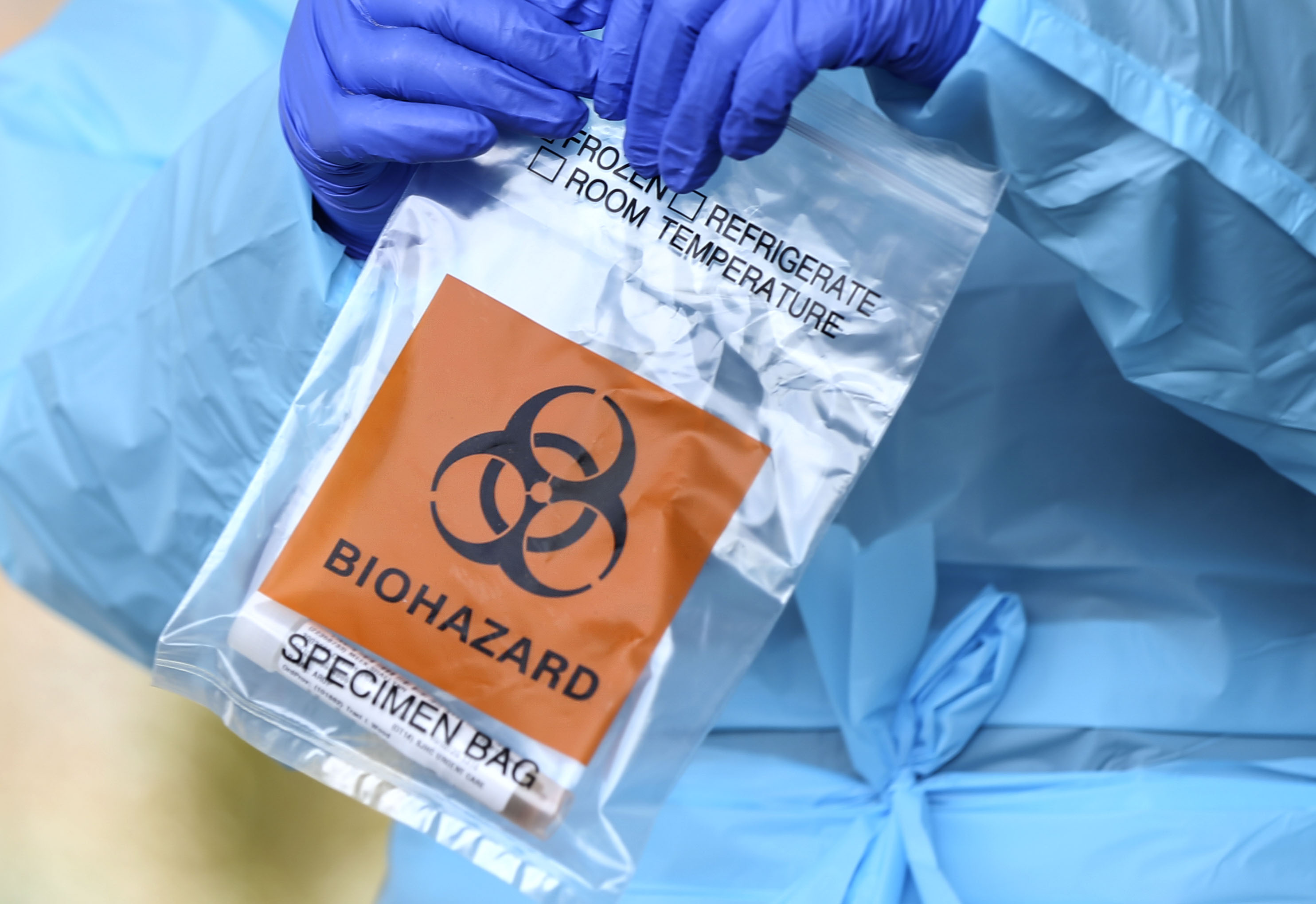 Medical assistant Guillianna Lint holds a COVID-19 test at University of Utah Health's South Jordan Health Center in South Jordan on Friday, Oct. 2, 2020.