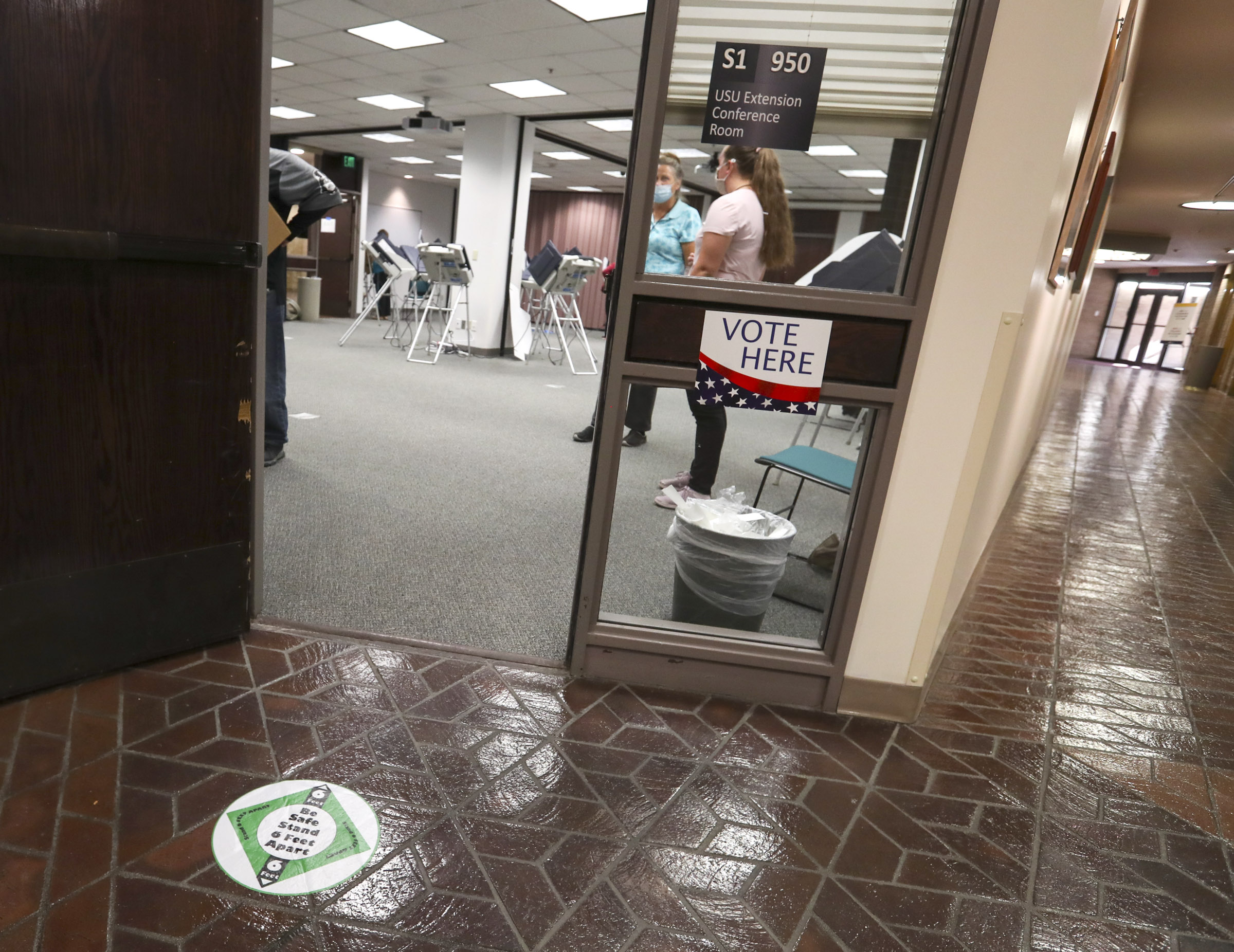Citizens cast their ballots in person at the Salt Lake County Government Center during the first day of early voting in Utah on Tuesday, Oct. 20, 2020.