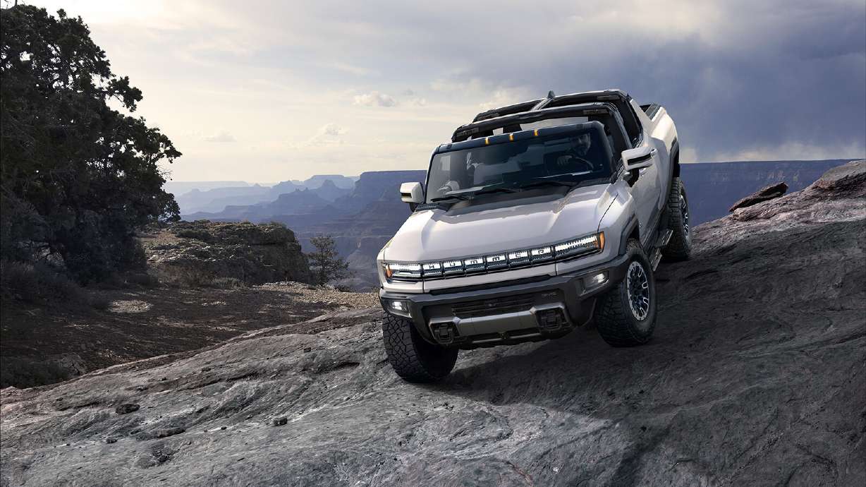 The GMC Hummer EV has four-wheel drive, four-wheel steering and an "Extract Mode" so the truck lifts itself up over obstacles.