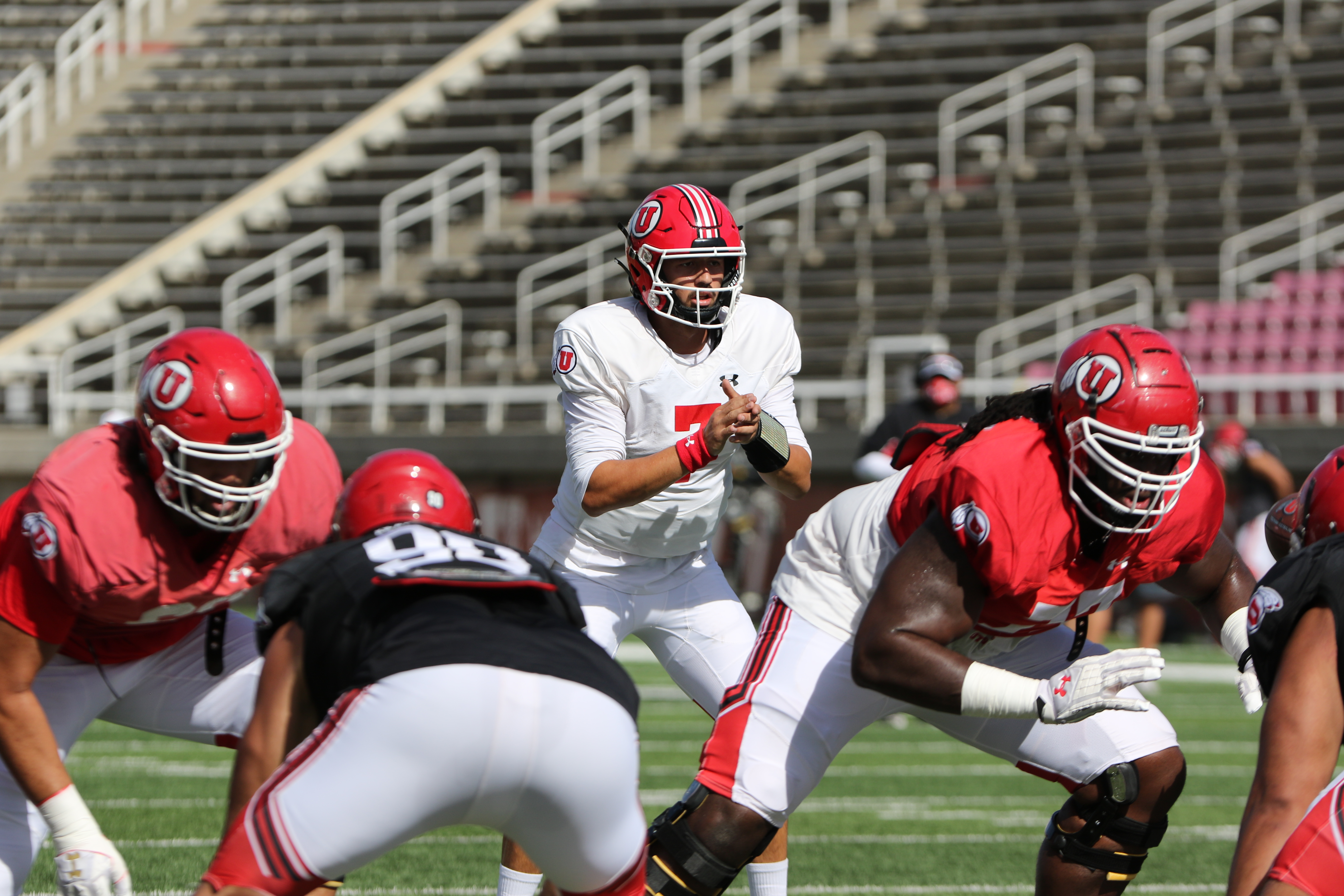 Quarterback Cameron Rising takes a snap during Utah's first scrimmage of the 2020 season.