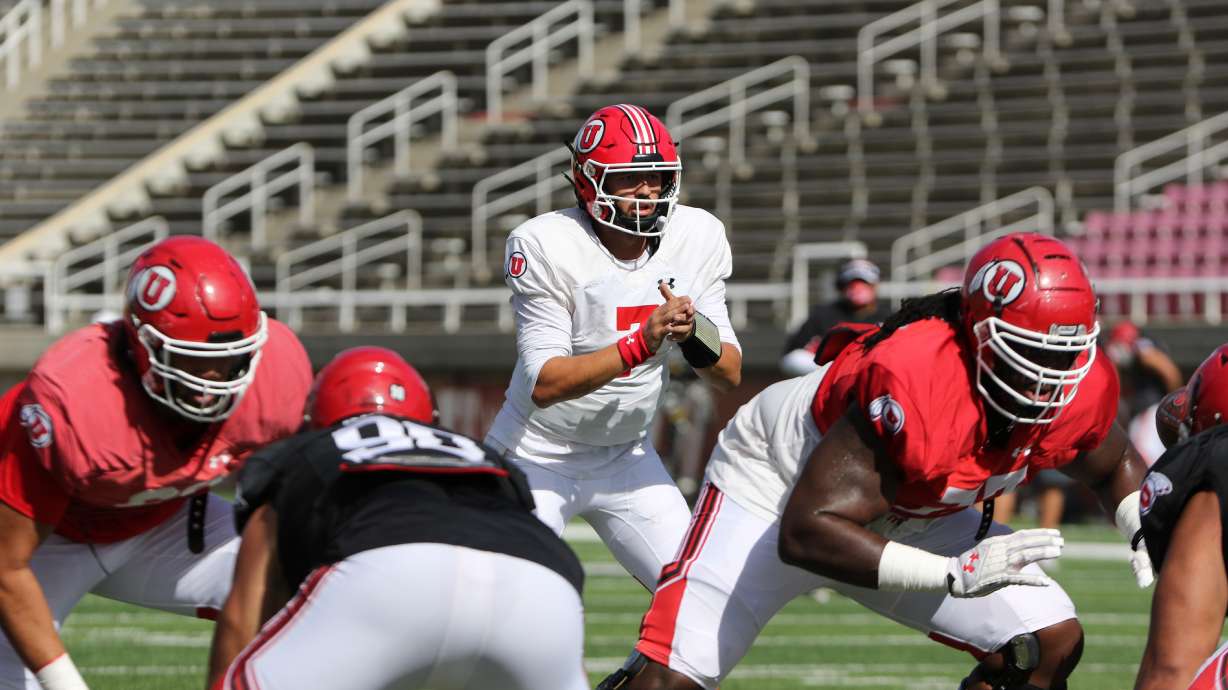 Quarterback Cameron Rising takes a snap during Utah's first scrimmage of the 2020 season.