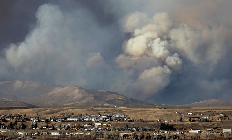 FILE PHOTO: Smoke fills the sky as the East Troublesome Fire burns outside Granby, Colorado, U.S. October 22, 2020. REUTERS/Jim Urquhart