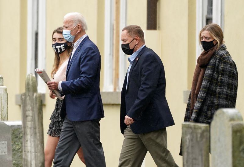 U.S. Democratic presidential candidate Joe Biden emerges from church with his granddaughters Natalie and Finnegan in Wilmington, Delaware, U.S., October 25, 2020. REUTERS/Kevin Lamarque
