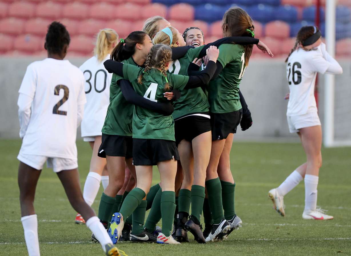 Rowland Hall celebrates winning the 2A girls soccer championship game against Real Salt Lake Academy at Rio Tinto Stadium in Sandy on Monday, Oct. 26, 2020. Rowland Hall won 3-2.