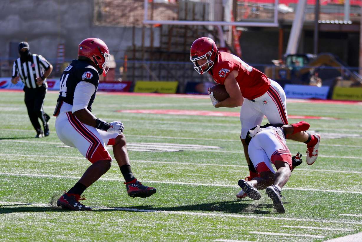 Tight end transfer Dalton Kincaid is tackled as Utah takes part in its first scrimmage of the season at Rice-Eccles Stadium on Oct. 17, 2020.