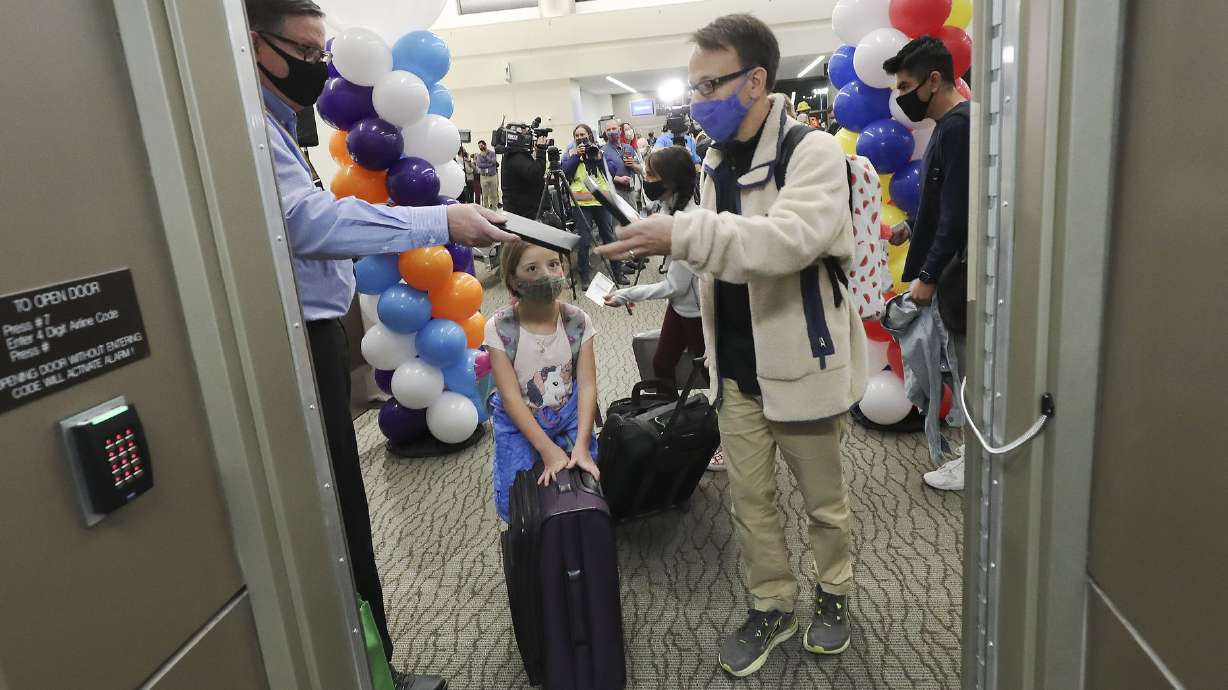 Mark Ginestro and his daughter, Anna, board the first flight out of the new Concourse B at the Salt Lake City International Airport in Salt Lake City on Tuesday, Oct. 27, 2020. Jeffrey D. Allred, Deseret News