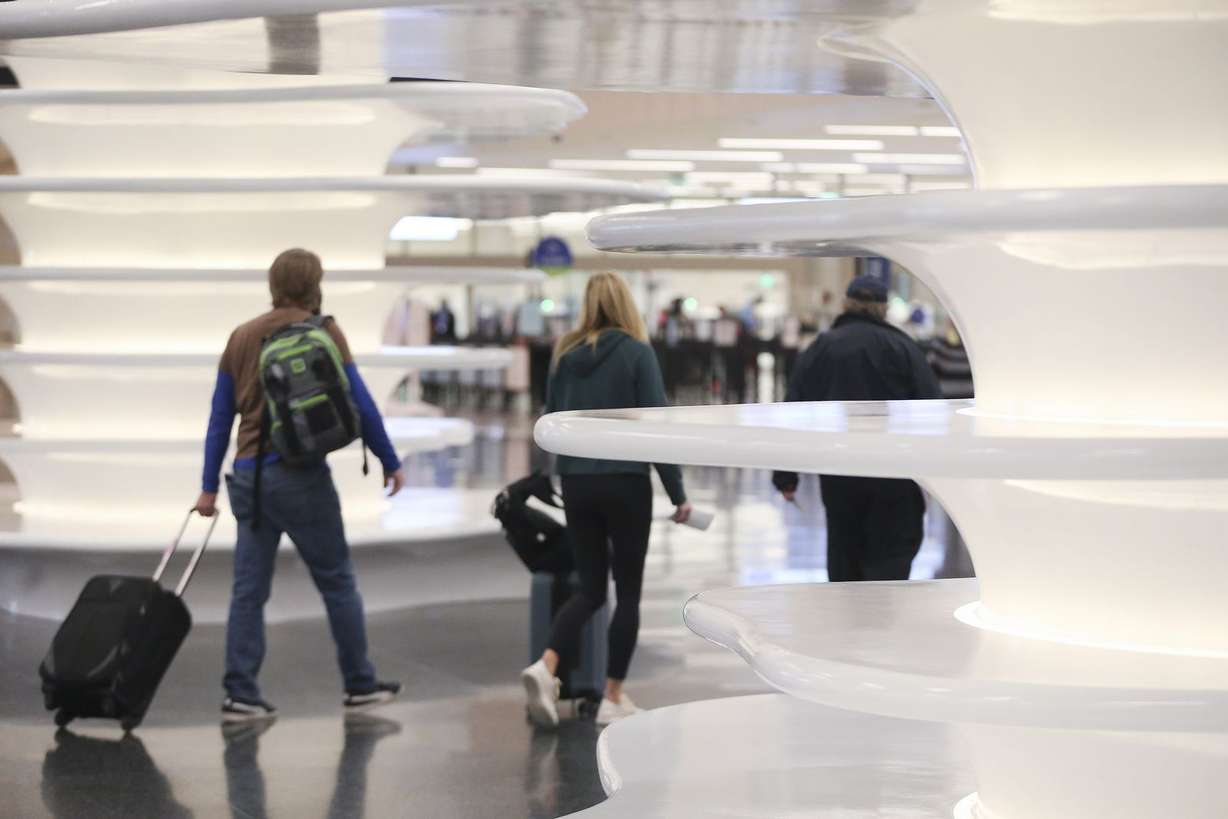 Passengers walk through the Salt Lake City International Airport in Salt Lake City on Tuesday, Oct. 27, 2020.
