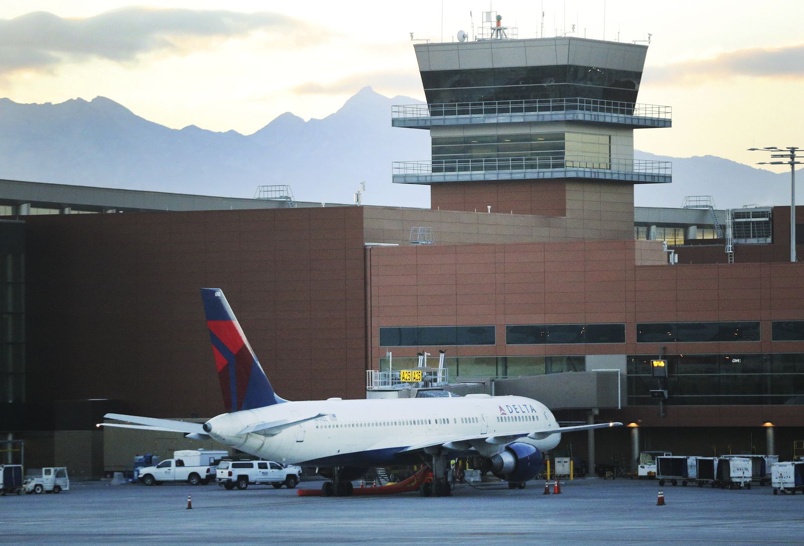 A view of a boarding Delta airplane is seen from the new Concourse B at the Salt Lake City International Airport in Salt Lake City on Tuesday, Oct. 27, 2020.