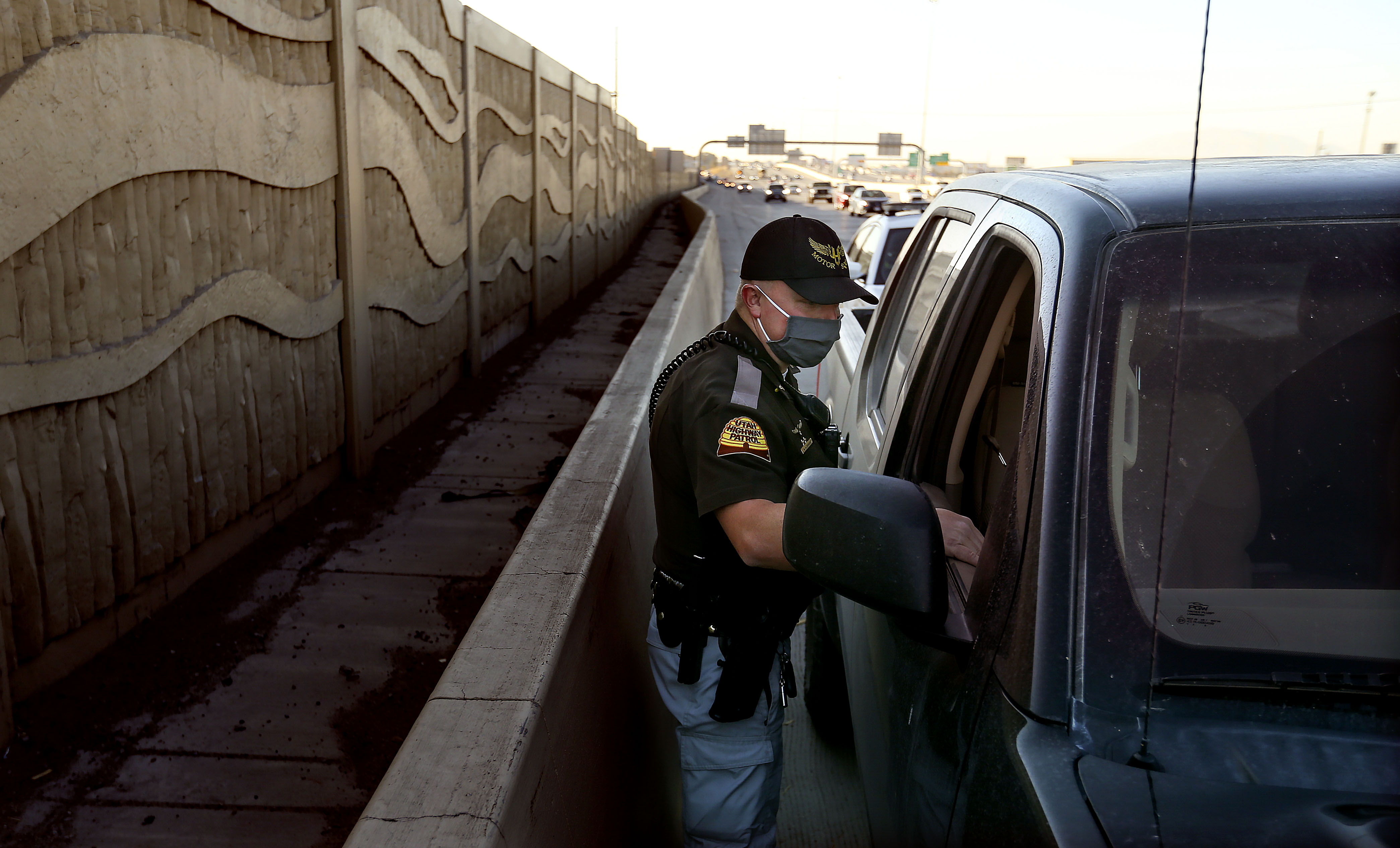 Utah Highway Patrol Cpl. Mike Alexander speaks to a driver about his use of a cellphone while driving in Utah County on Wednesday, Oct. 29, 2020. Seven Utah County law enforcement agencies participated in a distracted driving crackdown on Thursday.