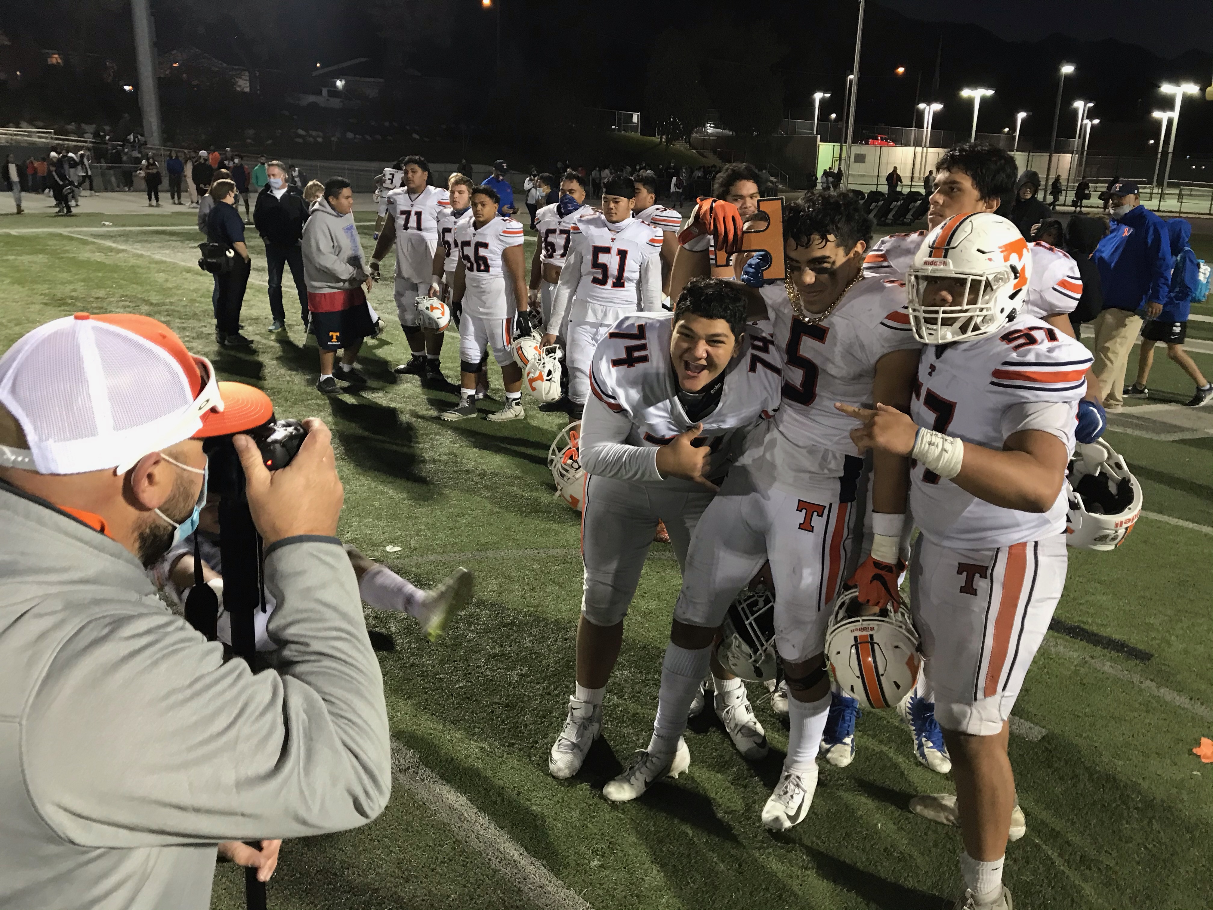 Timpview's Logan Fano with his teammates after the Thunderbirds' 35-13 win at Olympus, Friday, Oct. 30, 2020 in the second round of the Class 5A state playoffs.