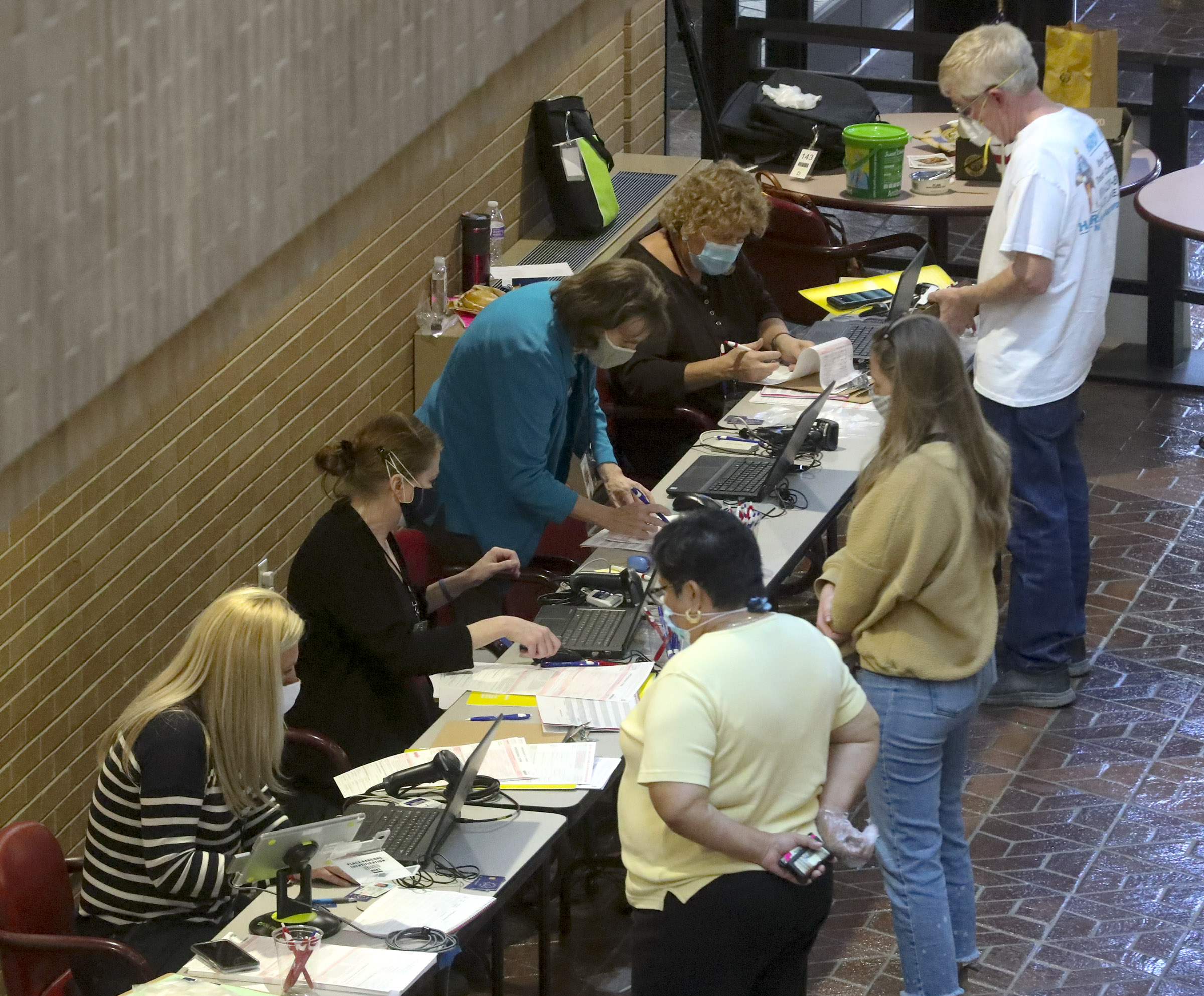 Citizens register to vote in person at the Salt Lake County Government Center during the first day of early voting in Utah on Tuesday, Oct. 20, 2020.