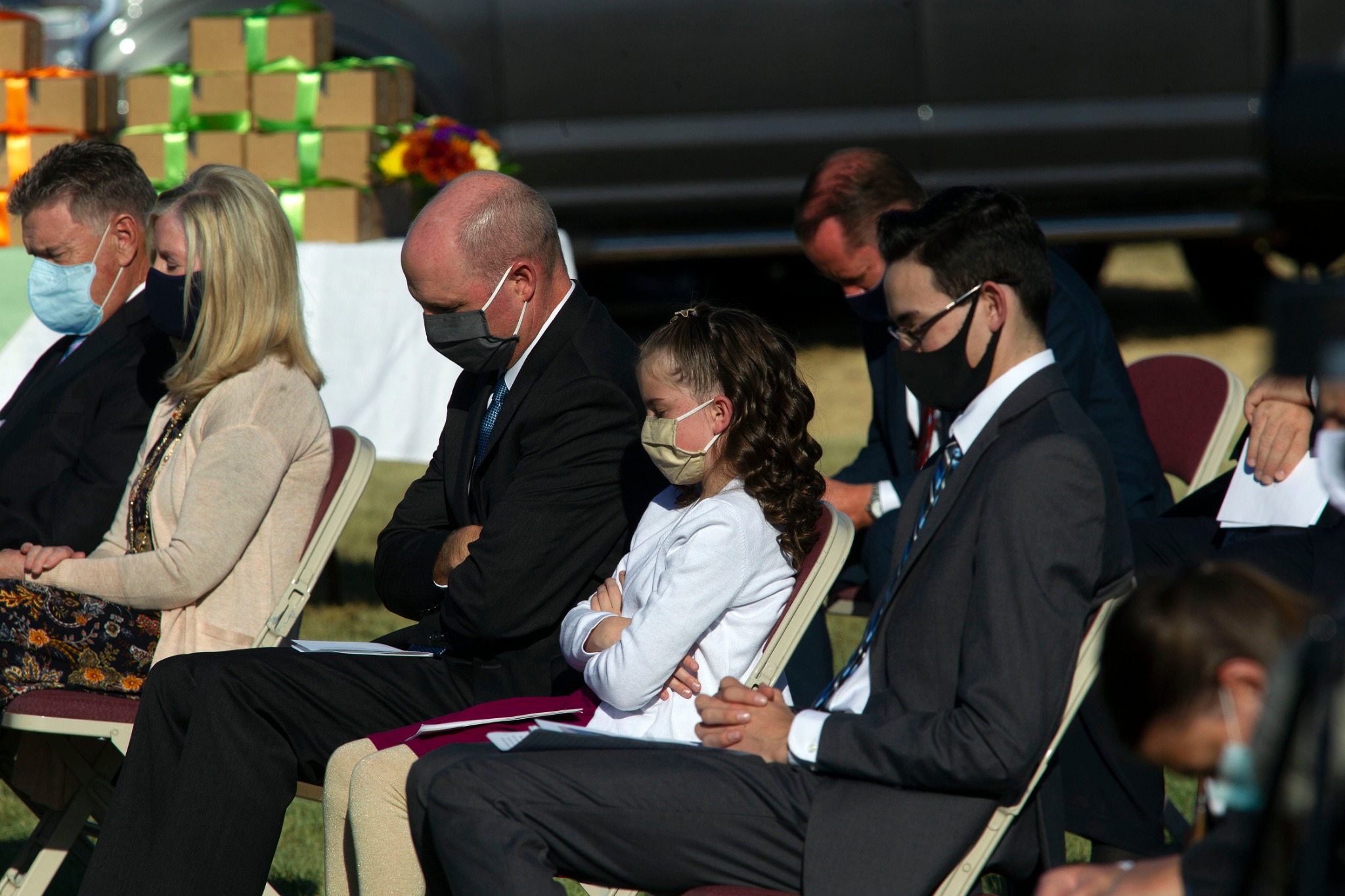 Invited guests pray during the groundbreaking service of the Taylorsville Utah Temple on Saturday, October 31, 2020.