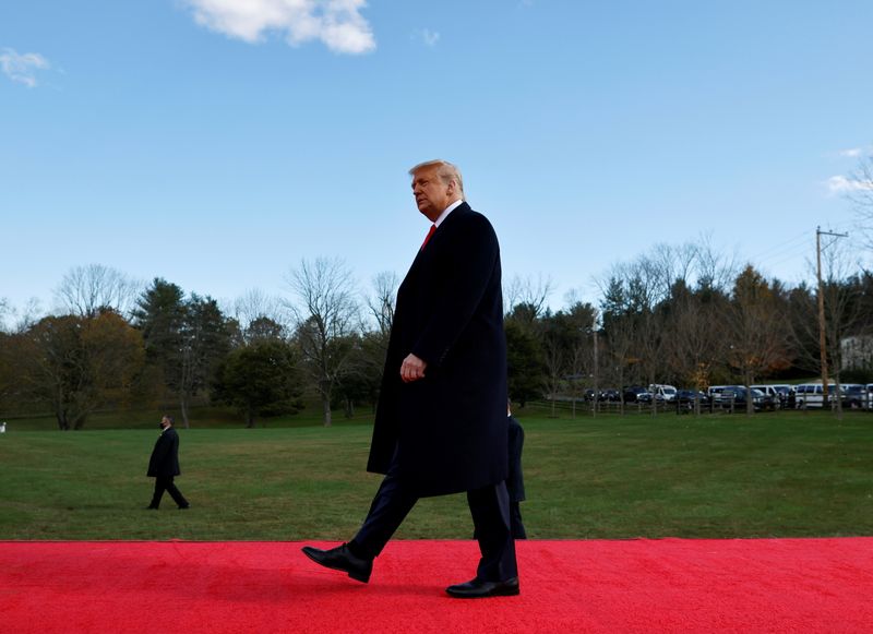 U.S. President Donald Trump walks during a campaign rally at Keith House-Washington's Headquarters in Newtown, Pennsylvania, U.S., October 31, 2020. REUTERS/Carlos Barria