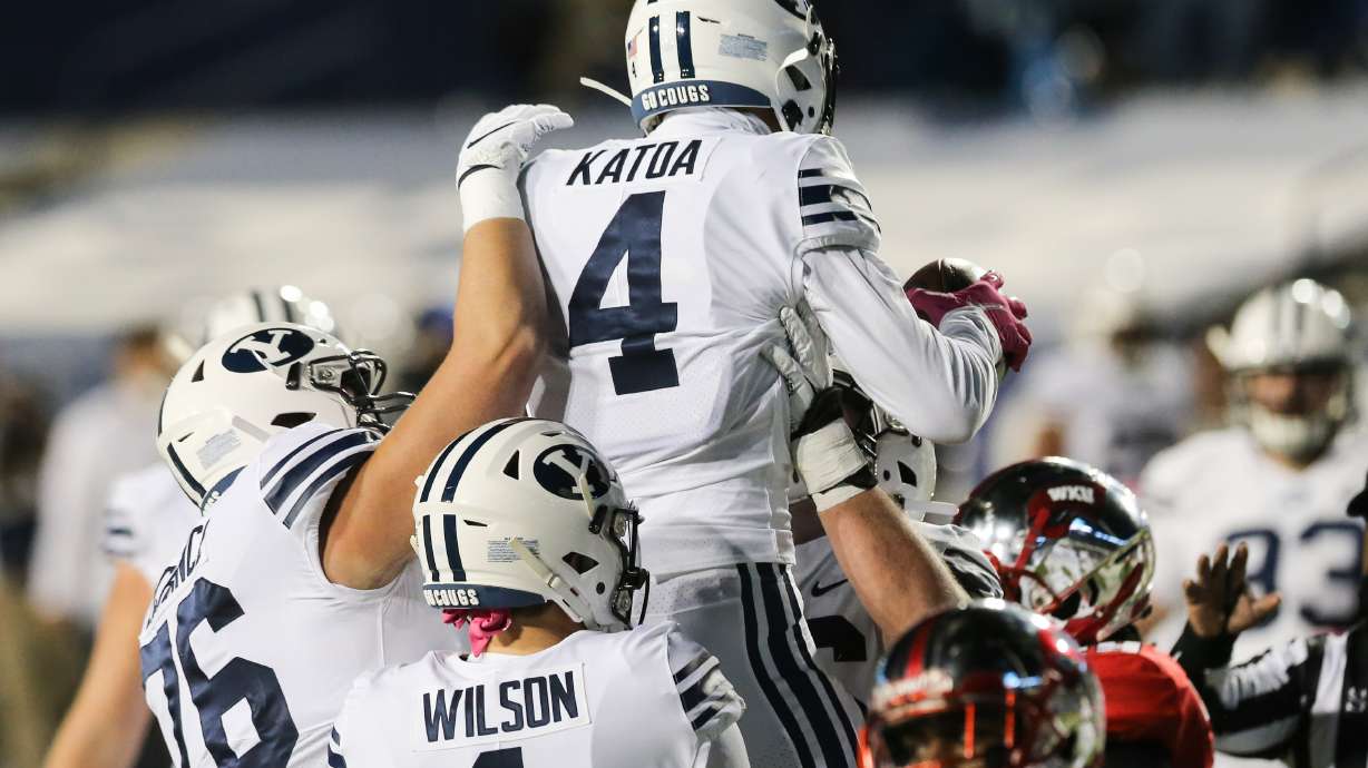 BYU running back Lopini Katoa celebrates a touchdown during a NCAA football game at LaVell Edwards Stadium in Provo on Saturday, Oct. 31, 2020.