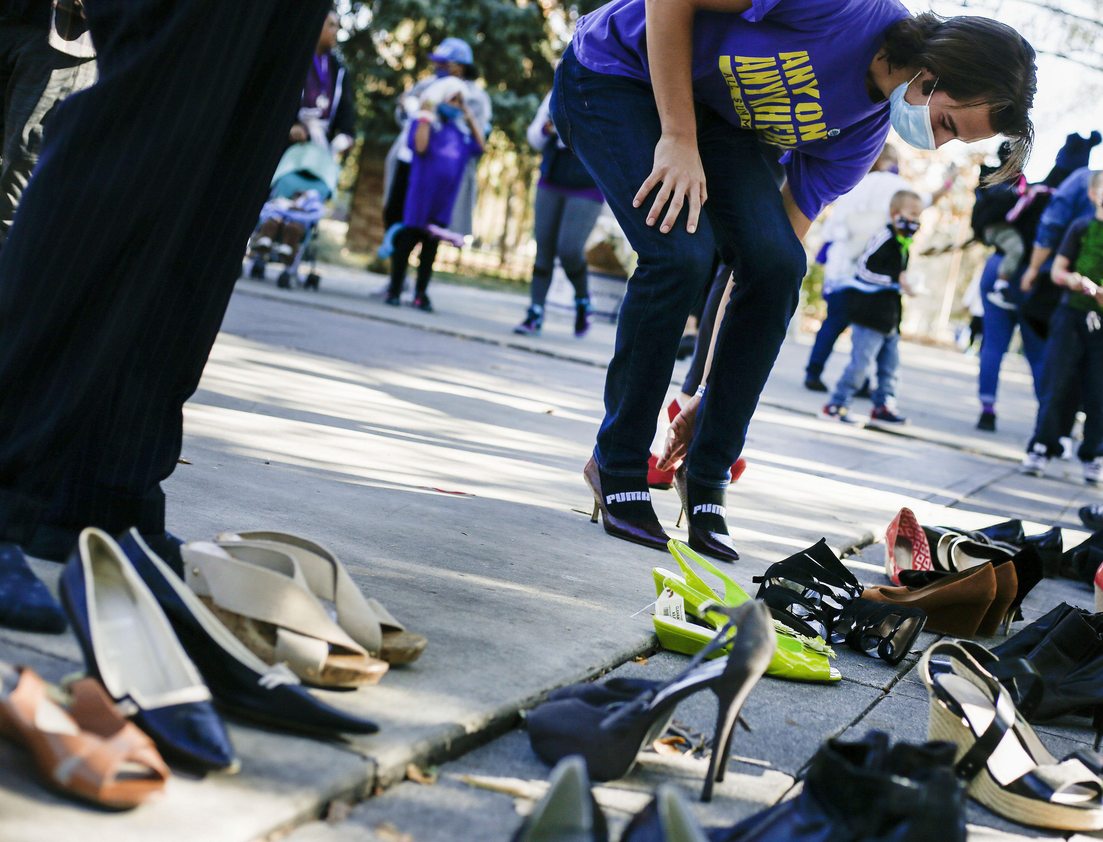 Family members and friends of Chynna Toilolo participate in the sixth annual In Heels 2 Heal domestic violence walk at the International Peace Gardens in Salt Lake City on Saturday, Oct. 31, 2020. Chynna Toilolo's body was found in Ogden Canyon in May, and in June her boyfriend was arrested and charged with murder.