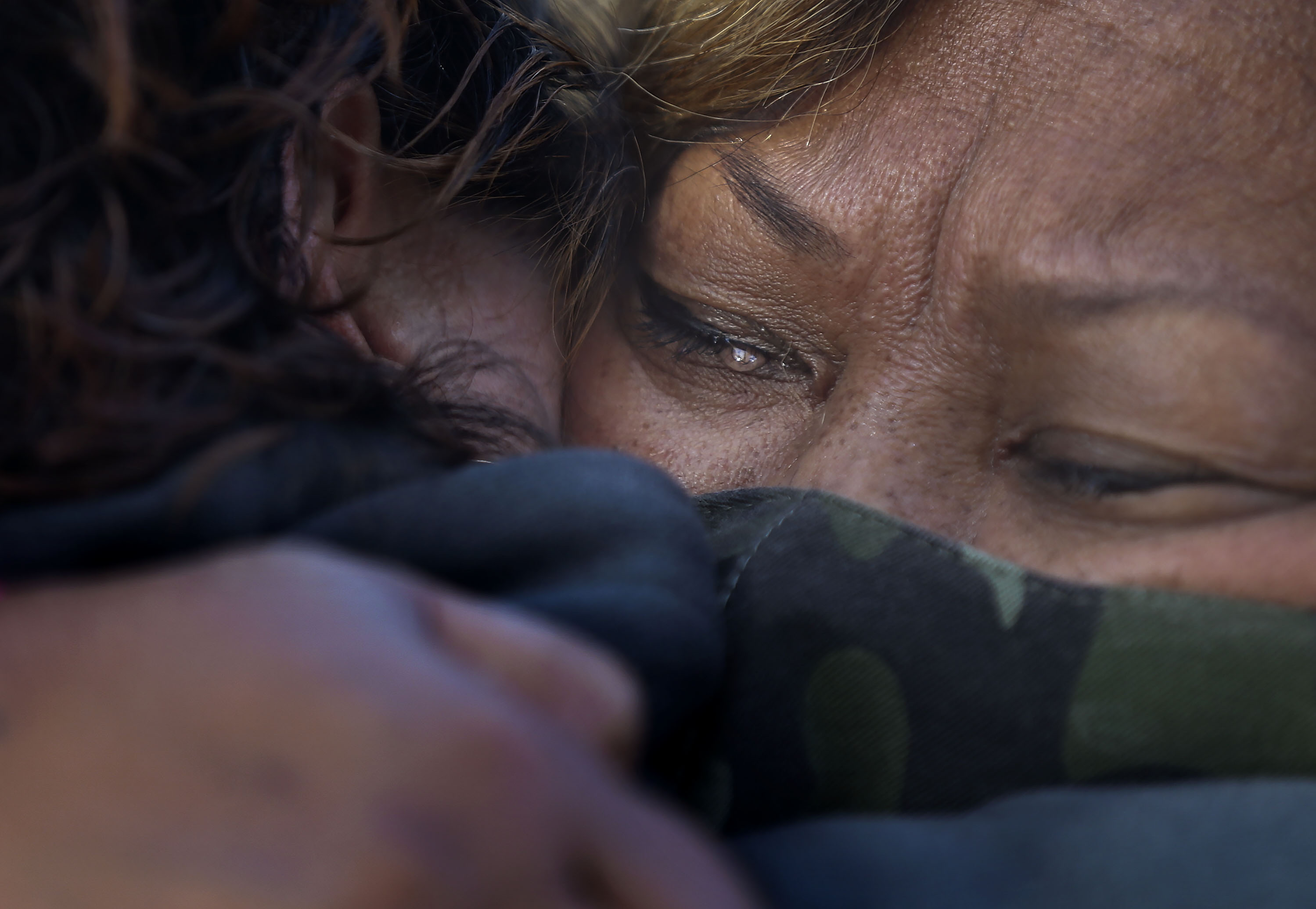 Terrie Toilolo, mother of Chynna Toilolo, cries at the sixth annual In Heels 2 Heal domestic violence walk at the International Peace Gardens in Salt Lake City on Saturday, Oct. 31, 2020. Chynna Toilolo's body was found in Ogden Canyon in May, and in June her boyfriend was arrested and charged with murder.