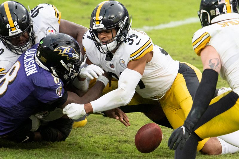 Nov 1, 2020; Baltimore, Maryland, USA; Pittsburgh Steelers free safety Minkah Fitzpatrick (39) hits Baltimore Ravens quarterback Lamar Jackson (8) as the ball hits the ground fourth quarter   at M&T Bank Stadium. Mandatory Credit: Tommy Gilligan-USA TODAY Sports