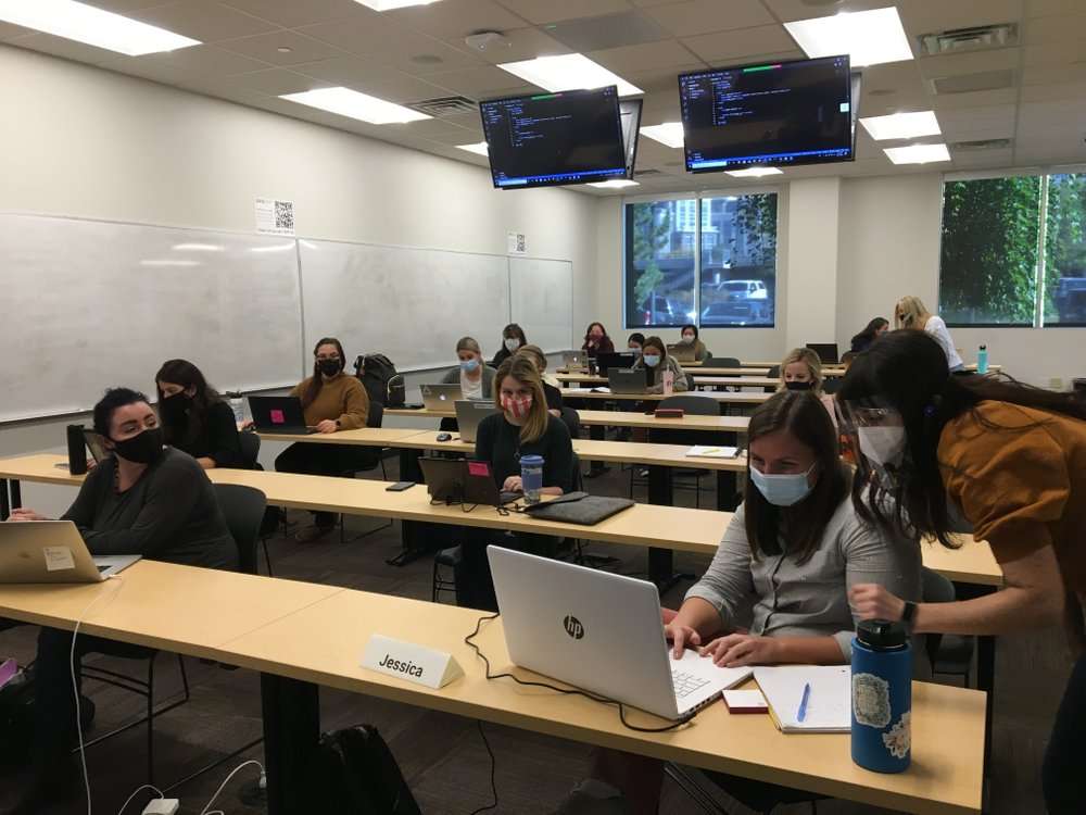 Women take part in the recently-launched TECH-MOMS program on Oct. 10, 2020, in Lehi, Utah, The 9-week intensive coding and mentorship program to help women break into the industry at a time when they need it most. (Jon Reed/KUER-FM via AP)