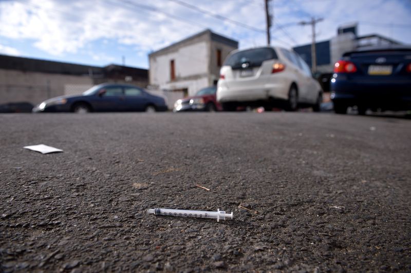 FILE PHOTO: A needle lays in the street in the Kensington section of Philadelphia, Pennsylvania, October 2017. REUTERS/Charles Mostoller