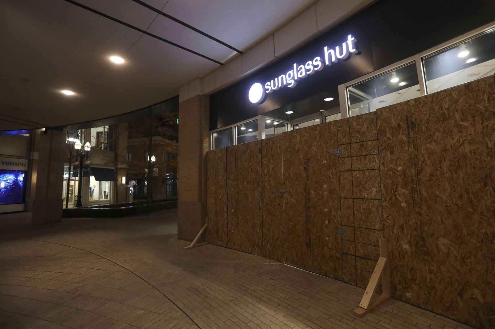 The windows at Sunglass Hut at City Creek Center are boarded up to protect against potential violence or civil unrest ahead of Election Day in Salt Lake City on Monday, Nov. 2, 2020.