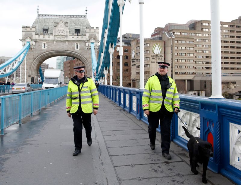 FILE PHOTO: City of London police patrol on Tower Bridge in London February 10, 2014, British police unveiled on Monday new toughened security measures to deter terrorist attacks on the City of London, one of the world's most important financial centres, saying its existing tactics had needed a revamp. REUTERS/Olivia Harris
