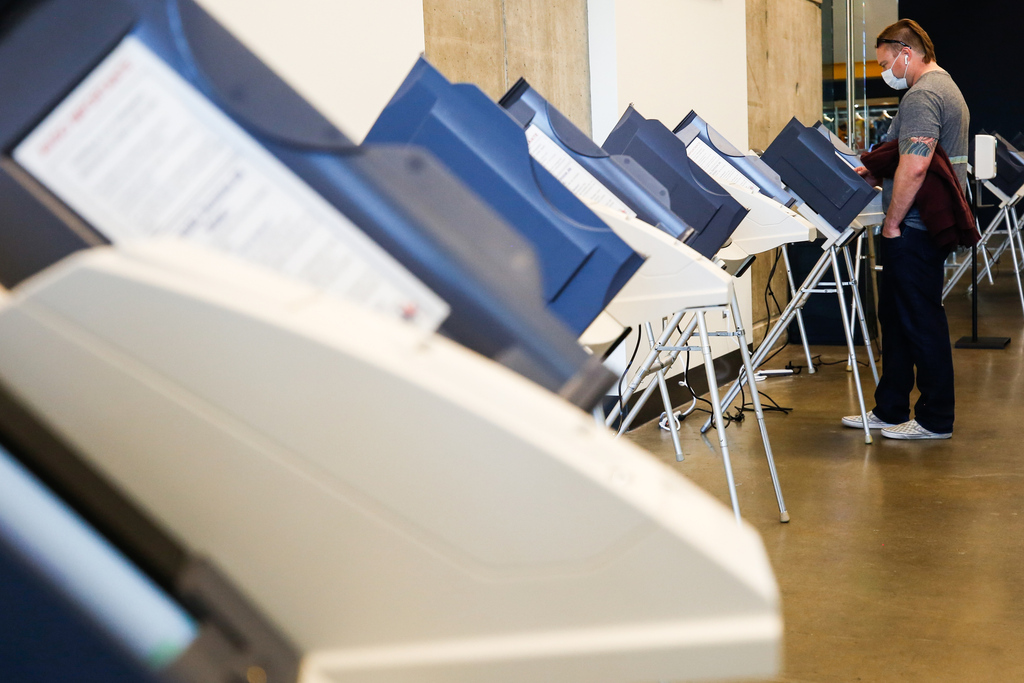 A voter fills in the ballot on the voting machine during the Election Day voting at Vivint SmartHome Arena in Salt Lake City on Tuesday, Nov. 3, 2020.