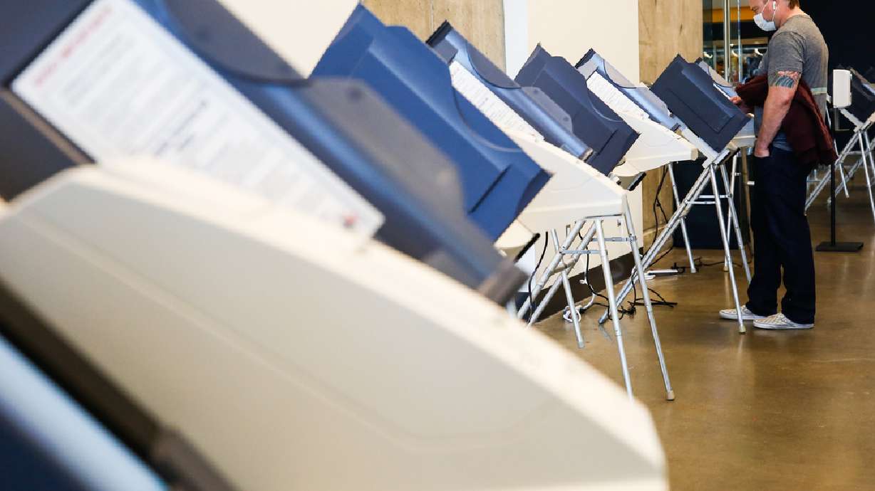 A voter fills in the ballot on the voting machine during the Election Day voting at Vivint SmartHome Arena in Salt Lake City on Tuesday, Nov. 3, 2020.