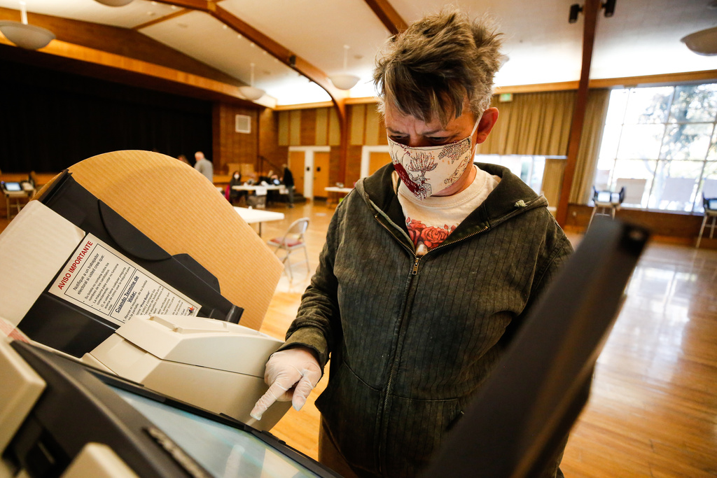 Corey Evans votes at the Columbus Center in South Salt Lake on Tuesday, Nov. 3, 2020.