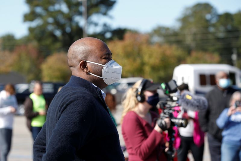 South Carolina Democratic Senate candidate Jaime Harrison looks over the long lines of voters at the Savannah Grove Precinct near Florence on Election Day in Effingham, South Carolina, U.S. November 3, 2020.