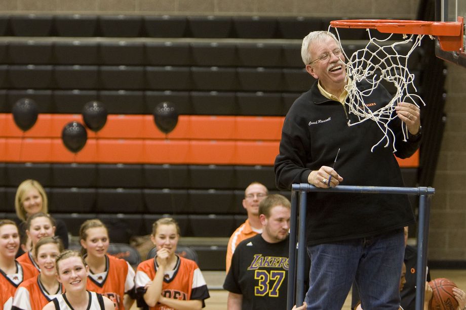 Ogden High School girls basketball coach Phil Russell celebrates his 500th win by cutting off the net after defeating the Box Elder Bees at Ogden High School on Feb. 18, 2010.