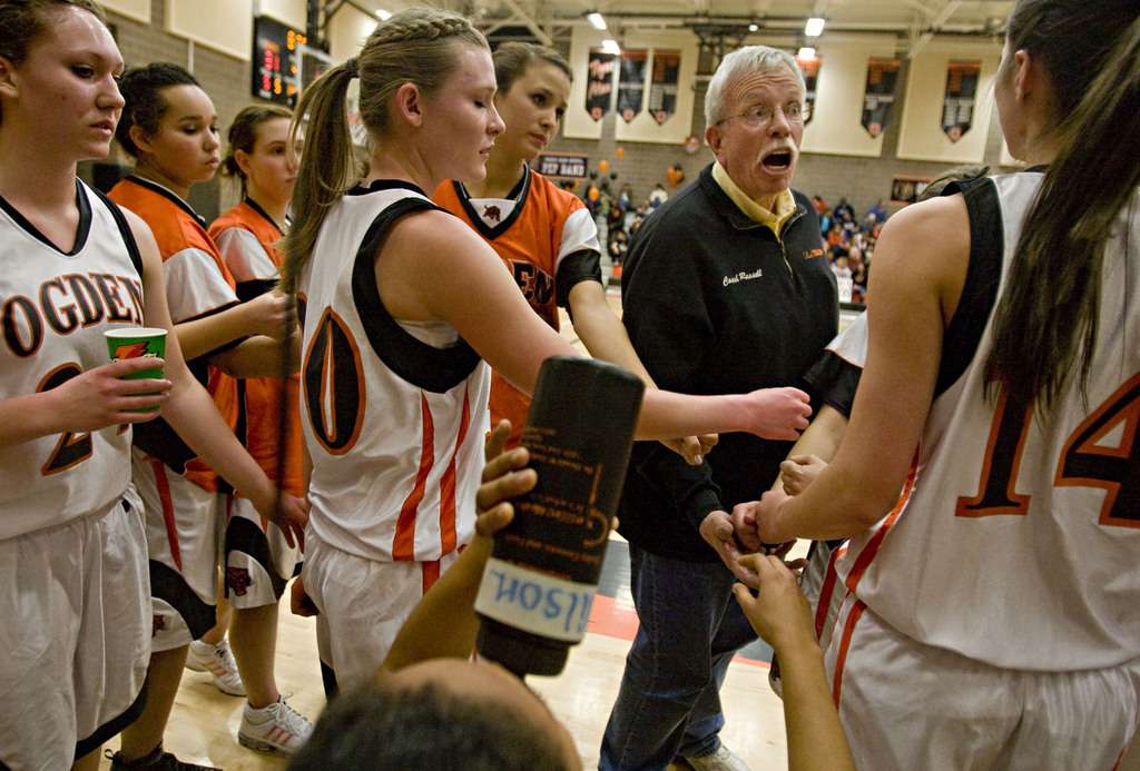 Ogden High School girl's basketball coach Phil Russell (in black) coaches his players en route to his 500th win as coach against the Box Elder Bees at Ogden High School in Ogden, Utah on Thursday, Feb., 18, 2010.