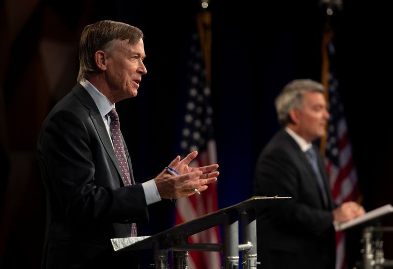 Republican U.S. Sen. Cory Gardner participates with Democratic challenger and former Colorado Gov. John Hickenlooper in the final debate in the 2020 race for Colorado's U.S. Senate seat at Colorado State University in Fort Collins, Colorado, on October 13, 2020.
